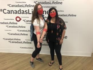 Registered nurse Jenn Brenneis, left, and Chelsea Bates, right, celebrate after donating. 