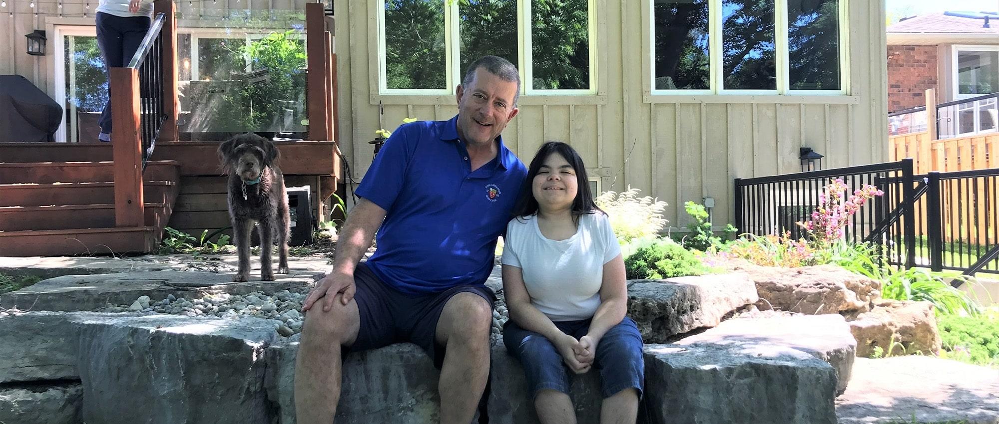 Stem cell donor and recipient sitting on a rock